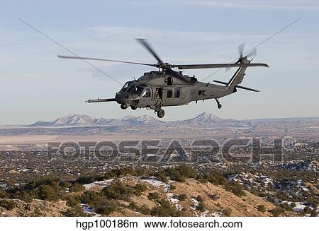 An HH-60G Pave Hawk flies a low level route over New Mexico. View Large Photo Image Picture - An HH-60G Pave Hawk flies a low level route over New Mexico.. Fotosearch