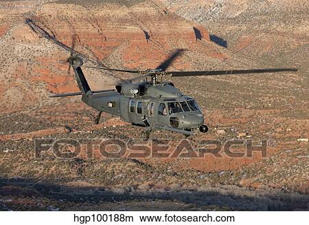 An HH-60G Pave Hawk flies a low level route over New Mexico. View Large Photo Image Picture - An HH-60G Pave Hawk flies a low level route over New Mexico.. Fotosearch