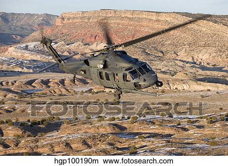 An HH-60G Pave Hawk flies a low level route over New Mexico. View Large Photo Image Picture - An HH-60G Pave Hawk flies a low level route over New Mexico.. Fotosearch