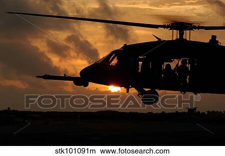An HH-60G Pave Hawk helicopter prepares to land. View Large Photo Image Picture - An HH-60G Pave Hawk helicopter prepares to land.. Fotosearch