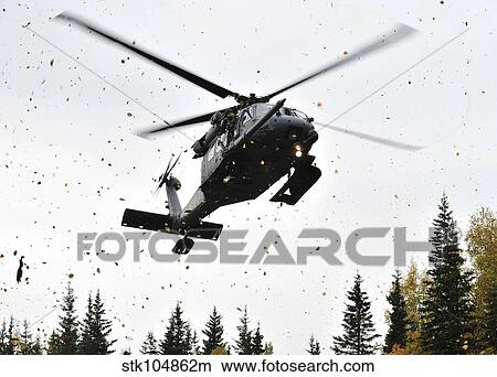 An HH-60G Pave Hawk helicopter prepares for landing. View Large Photo Image Picture - An HH-60G Pave Hawk helicopter prepares for landing.. Fotosearch