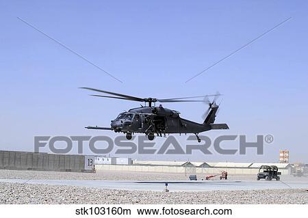 An HH-60G Pave Hawk taking off from Camp Bastion, Afghanistan. View Large Photo Image Picture - An HH-60G Pave Hawk taking off from Camp Bastion, Afghanistan.. Fotosearch