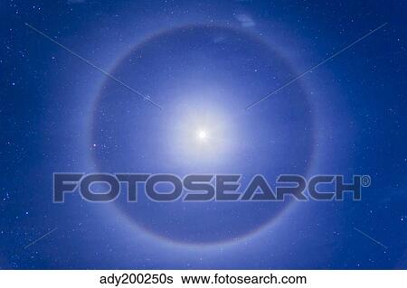 An ice crystal halo around the first quarter moon. View Large Photo Image Stock Photograph - An ice crystal halo around the first quarter moon.. Fotosearch