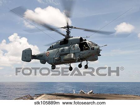 An Indian Navy Kamov Ka-31 lands on the flight deck of USS Bunker Hill. View Large Photo Image Picture - An Indian Navy Kamov Ka-31 lands on the flight deck of USS Bunker Hill.. Fotosearch
