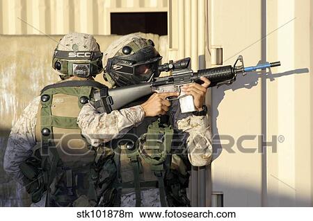 An infantry scout aims his weapon. View Large Photo Image Picture - An infantry scout aims his weapon.. Fotosearch
