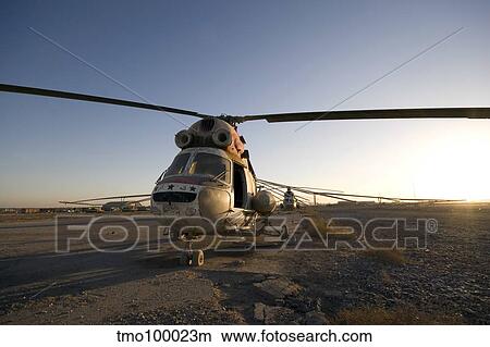 An Iraqi helicopter sits on the flight deck abandoned at Camp Warhorse. View Large Photo Image Picture - An Iraqi helicopter sits on the flight deck abandoned at Camp Warhorse.. Fotosearch