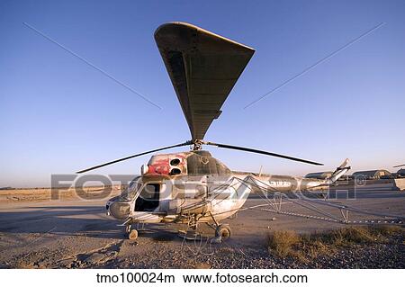 An Iraqi helicopter sits on the flight deck abandoned at Camp Warhorse. View Large Photo Image Picture - An Iraqi helicopter sits on the flight deck abandoned at Camp Warhorse.. Fotosearch