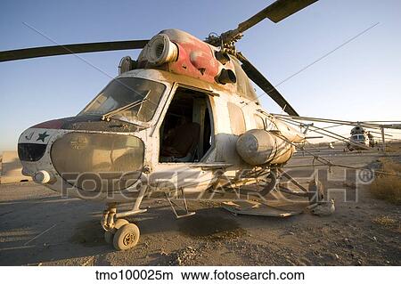 An Iraqi helicopter sits on the flight deck abandoned at Camp Warhorse. View Large Photo Image Picture - An Iraqi helicopter sits on the flight deck abandoned at Camp Warhorse.. Fotosearch