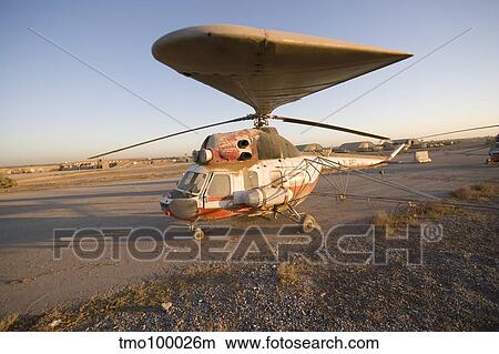 An Iraqi helicopter sits on the flight deck abandoned at Camp Warhorse. View Large Photo Image Picture - An Iraqi helicopter sits on the flight deck abandoned at Camp Warhorse.. Fotosearch