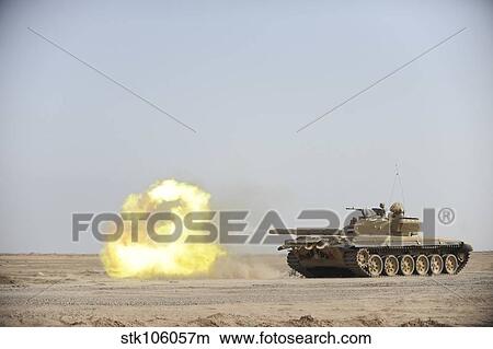 An Iraqi T-72 tank fires at the Besmaya Gunnery Range, Iraq. View Large Photo Image Picture - An Iraqi T-72 tank fires at the Besmaya Gunnery Range, Iraq.. Fotosearch
