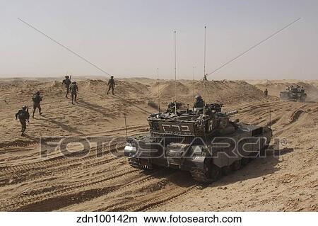 An Israel Defense Force Merkava Mark II battle tank with infantry forces. View Large Photo Image Picture - An Israel Defense Force Merkava Mark II battle tank with infantry forces.. Fotosearch