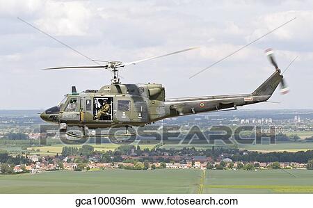 An Italian Air Force AB-212 ICO helicopter over France. View Large Photo Image Picture - An Italian Air Force AB-212 ICO helicopter over France.. Fotosearch