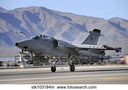 An Italian Air Force AMX fighter landing at Nellis Air Force Base in Nevada. View Large Photo Image Picture - An Italian Air Force AMX fighter landing at Nellis Air Force Base in Nevada.. Fotosearch