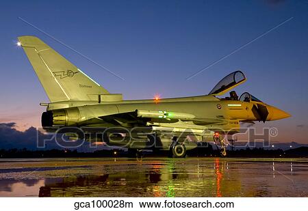 An Italian Air Force Eurofighter Typhoon at night on Decimomannu Air Base, Italy. View Large Photo Image Picture - An Italian Air Force Eurofighter Typhoon at night on Decimomannu Air Base, Italy.. Fotosearch