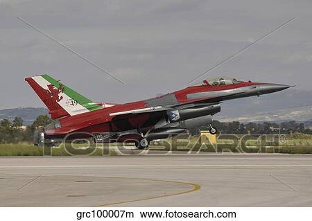 An Italian Air Force F-16 Air Defense Fighter landing at Trapani Airport, Italy. View Large Photo Image Picture - An Italian Air Force F-16 Air Defense Fighter landing at Trapani Airport, Italy.. Fotosearch