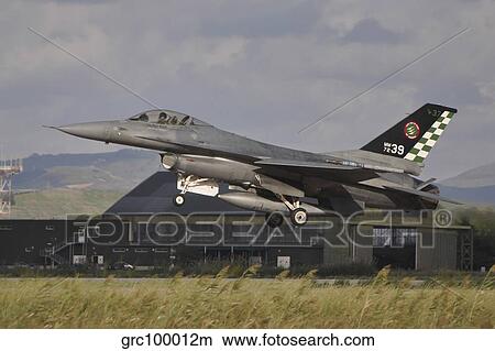 An Italian Air Force F-16 Air Defense Fighter taking off. View Large Photo Image Picture - An Italian Air Force F-16 Air Defense Fighter taking off.. Fotosearch