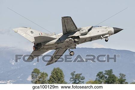 An Italian Air Force Panavia Tornado takes off from Rivolto Air Base in the north of Italy. View Large Photo Image Picture - An Italian Air Force Panavia Tornado takes off from Rivolto Air Base in the north of Italy.. Fotosearch