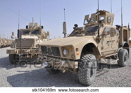 An M-ATV Mine Resistant Ambush Protected vehicle parked next to a MaxxPro MRAP. View Large Photo Image Picture - An M-ATV Mine Resistant Ambush Protected vehicle parked next to a MaxxPro MRAP.. Fotosearch