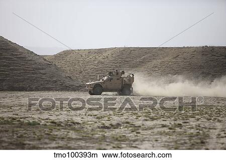 An M-ATV races across the wadi near Kunduz, Afghanistan. View Large Photo Image Picture - An M-ATV races across the wadi near Kunduz, Afghanistan.. Fotosearch