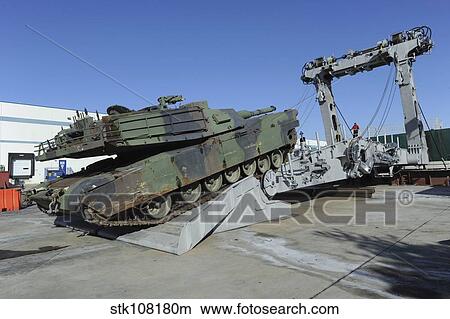 Picture - An M1A1 Abrams tank drives over an advanced light-weight ramp.. Fotosearch
