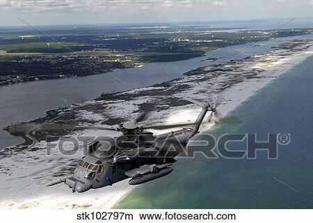 An MH-53 Pave Low flies over the coastline of Florida. View Large Photo Image Picture - An MH-53 Pave Low flies over the coastline of Florida.. Fotosearch