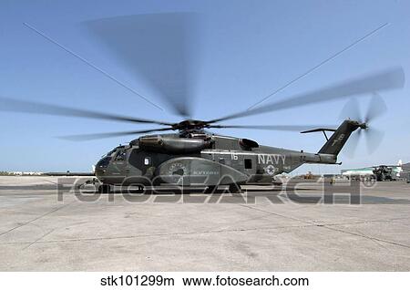 An MH-53E Sea Dragon helicopter sits ready on the flight line. View Large Photo Image Picture - An MH-53E Sea Dragon helicopter sits ready on the flight line.. Fotosearch