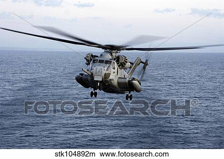 An MH-53E Sea Dragon in flight over the Pacific Ocean. View Large Photo Image Picture - An MH-53E Sea Dragon in flight over the Pacific Ocean.. Fotosearch