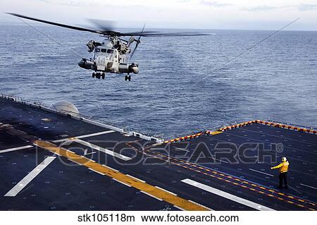 An MH-53E Sea Dragon prepares to land aboard USS Bonhomme Richard. View Large Photo Image Picture - An MH-53E Sea Dragon prepares to land aboard USS Bonhomme Richard.. Fotosearch