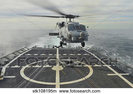 An MH-60R Sea Hawk helicopter lands aboard USS Halyburton. View Large Photo Image Picture - An MH-60R Sea Hawk helicopter lands aboard USS Halyburton.. Fotosearch