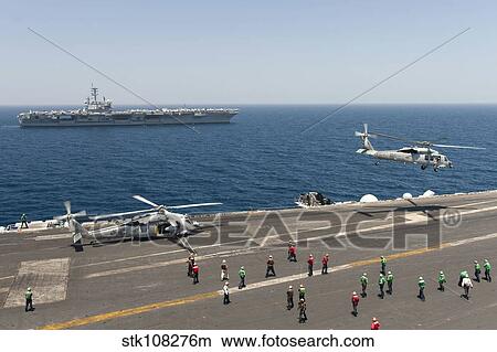 An MH-60R Sea Hawk helicopter launches from USS Harry S. Truman. View Large Photo Image Picture - An MH-60R Sea Hawk helicopter launches from USS Harry S. Truman.. Fotosearch