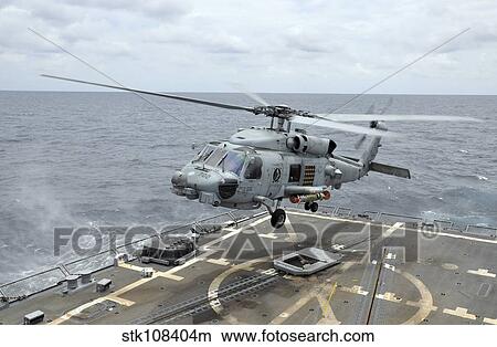 An MH-60R Sea Hawk helicopter lifts off from USS Wayne E. Meyer. View Large Photo Image Picture - An MH-60R Sea Hawk helicopter lifts off from USS Wayne E. Meyer.. Fotosearch
