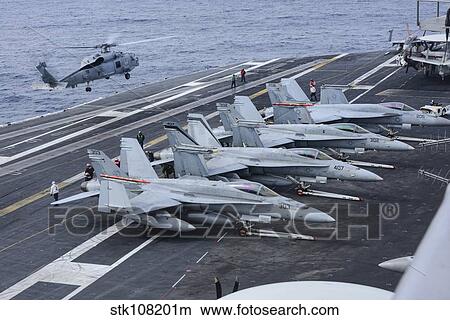 An MH-60R Sea Hawk lands on the flight deck of USS Carl Vinson. View Large Photo Image Picture - An MH-60R Sea Hawk lands on the flight deck of USS Carl Vinson.. Fotosearch