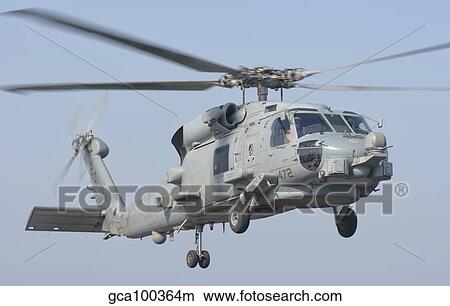 An MH-60R Seahawk in flight over the Persian Gulf. View Large Photo Image Picture - An MH-60R Seahawk in flight over the Persian Gulf.. Fotosearch