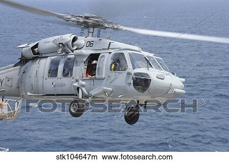 An MH-60S Sea Hawk search and rescue helicopter. View Large Photo Image Picture - An MH-60S Sea Hawk search and rescue helicopter.. Fotosearch