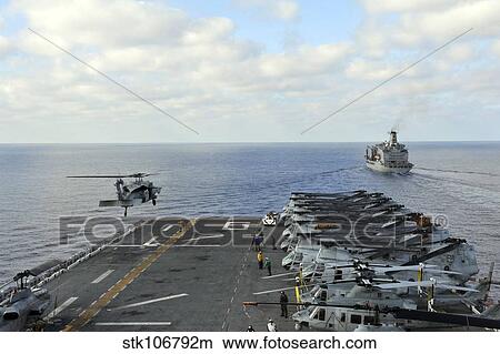 Picture - An MH-60S Sea Hawk takes off from the flight deck of USS Bonhomme Richard.. Fotosearch