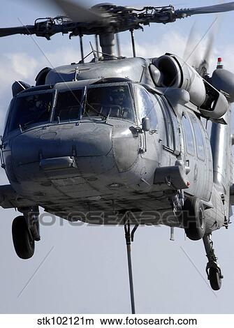 An MH-60S Seahawk delivers a pallet of MK 83/BLU-110 general-purpose bombs. View Large Photo Image Picture - An MH-60S Seahawk delivers a pallet of MK 83/BLU-110 general-purpose bombs.. Fotosearch