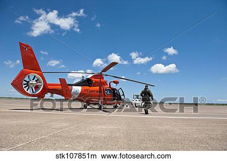 An MH-65C Dolphin helicopter of the U. S. Coast Guard. View Large Photo Image Picture - An MH-65C Dolphin helicopter of the U. S. Coast Guard.. Fotosearch