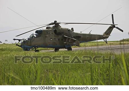 An Mi-35 attack helicopter at Kunduz Airfield, Afghanistan. View Large Photo Image Picture - An Mi-35 attack helicopter at Kunduz Airfield, Afghanistan.. Fotosearch