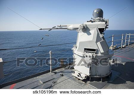 An Mk-38 machine gun system aboard USS Pearl Harbor. View Large Photo Image Picture - An Mk-38 machine gun system aboard USS Pearl Harbor.. Fotosearch