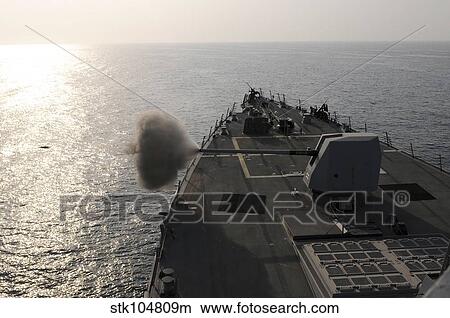 An Mk-45 lightweight gun is fired aboard guided missile destroyer USS Truxtun. View Large Photo Image Picture - An Mk-45 lightweight gun is fired aboard guided missile destroyer USS Truxtun.. Fotosearch