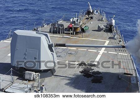 An MK-45 lightweight gun is fired aboard USS Forrest Sherman. View Large Photo Image Picture - An MK-45 lightweight gun is fired aboard USS Forrest Sherman.. Fotosearch