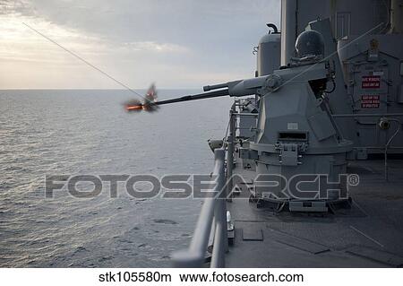 An MK38 MOD 2 25mm machine gun system aboard USS Pearl Harbor. View Large Photo Image Picture - An MK38 MOD 2 25mm machine gun system aboard USS Pearl Harbor.. Fotosearch