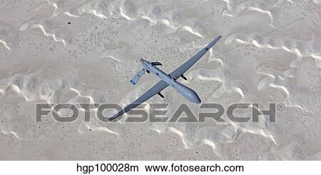 An MQ-1 Predator flies over the White Sands National Monument, New Mexico. View Large Photo Image Picture - An MQ-1 Predator flies over the White Sands National Monument, New Mexico.. Fotosearch