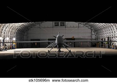 An MQ-1C Sky Warrior UAV parked in a hangar. View Large Photo Image Picture - An MQ-1C Sky Warrior UAV parked in a hangar.. Fotosearch
