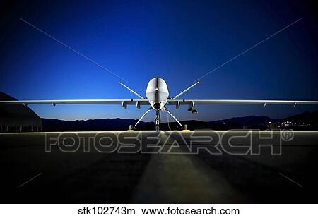 An MQ-9 Reaper sits on the flightline. View Large Photo Image Picture - An MQ-9 Reaper sits on the flightline.. Fotosearch