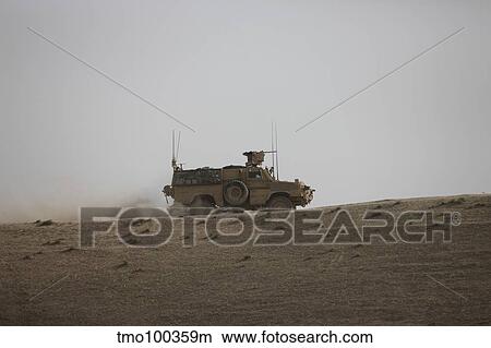 An MRAP vehicle patrols the ridge of a wadi near Kunduz, Afghnanistan. View Large Photo Image Picture - An MRAP vehicle patrols the ridge of a wadi near Kunduz, Afghnanistan.. Fotosearch
