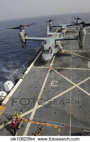 An MV-22 Osprey lands aboard USS Mesa Verde. View Large Photo Image Picture - An MV-22 Osprey lands aboard USS Mesa Verde.. Fotosearch