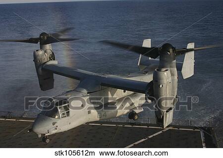 An MV-22 Osprey prepares to land aboard USNS Robert E. Peary. View Large Photo Image Picture - An MV-22 Osprey prepares to land aboard USNS Robert E. Peary.. Fotosearch