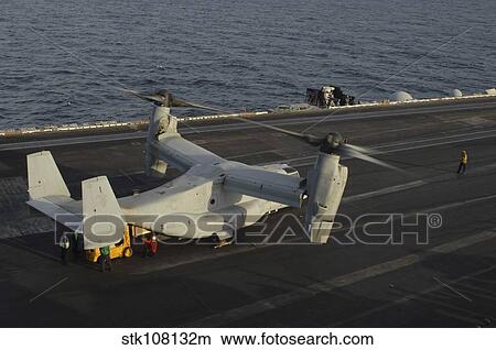 Picture - An MV-22 Osprey receives cargo on the flight deck of USS Harry S. Truman.. Fotosearch