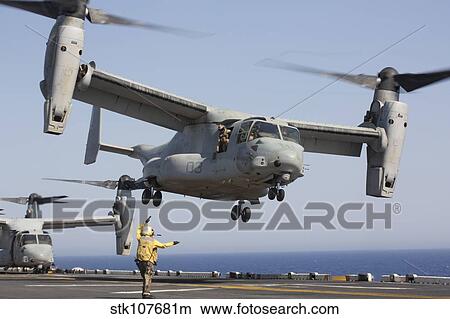 An MV-22 Osprey takes off from the amphibious assault ship USS Kearsarge. View Large Photo Image Picture - An MV-22 Osprey takes off from the amphibious assault ship USS Kearsarge.. Fotosearch